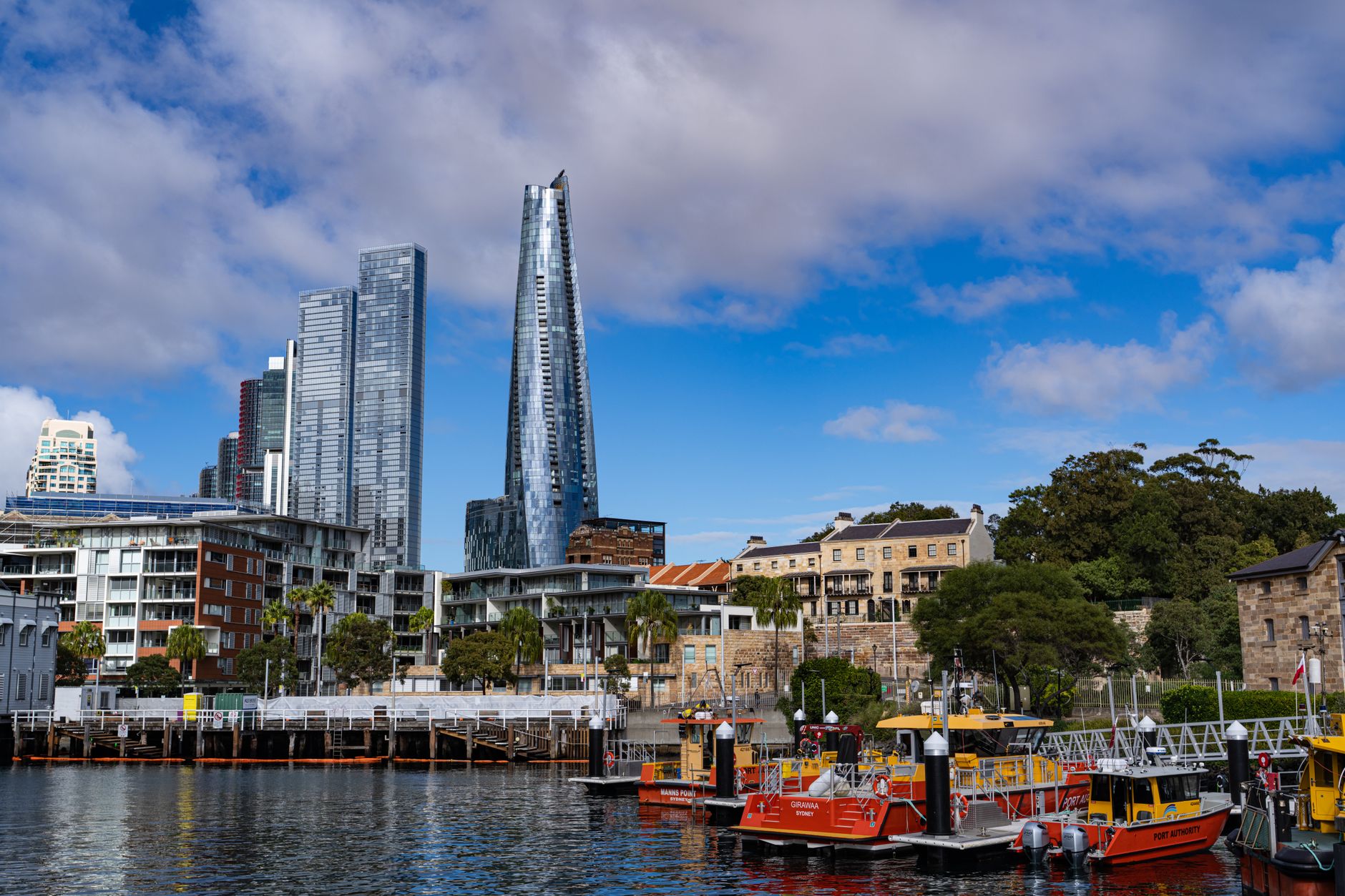 Sydney waterfront with modern skyscrapers and historic buildings by the water