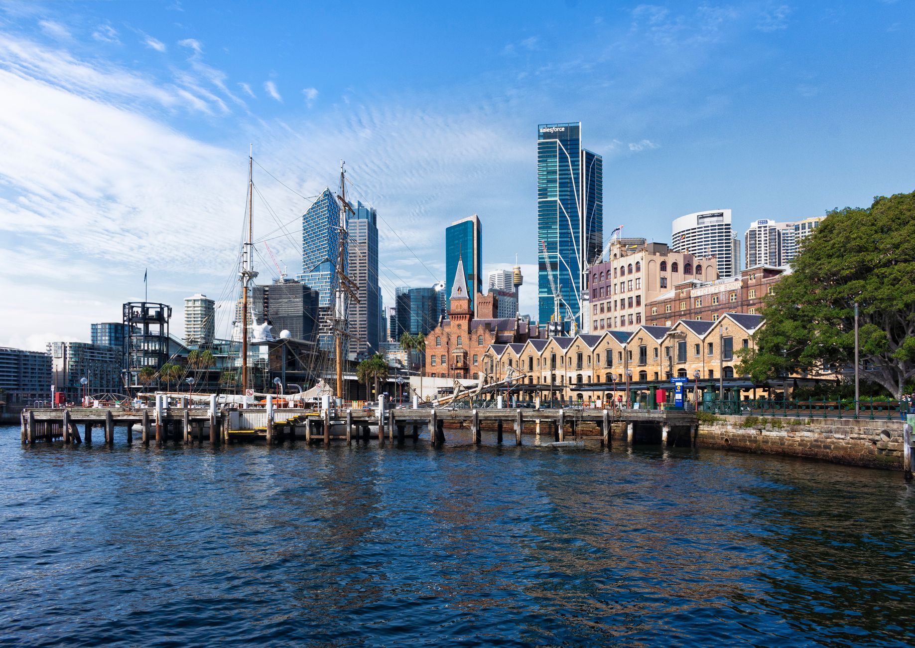 Campbells Cove in the historic Rocks neighbourhood, with an old ship moored and the skyline in the background