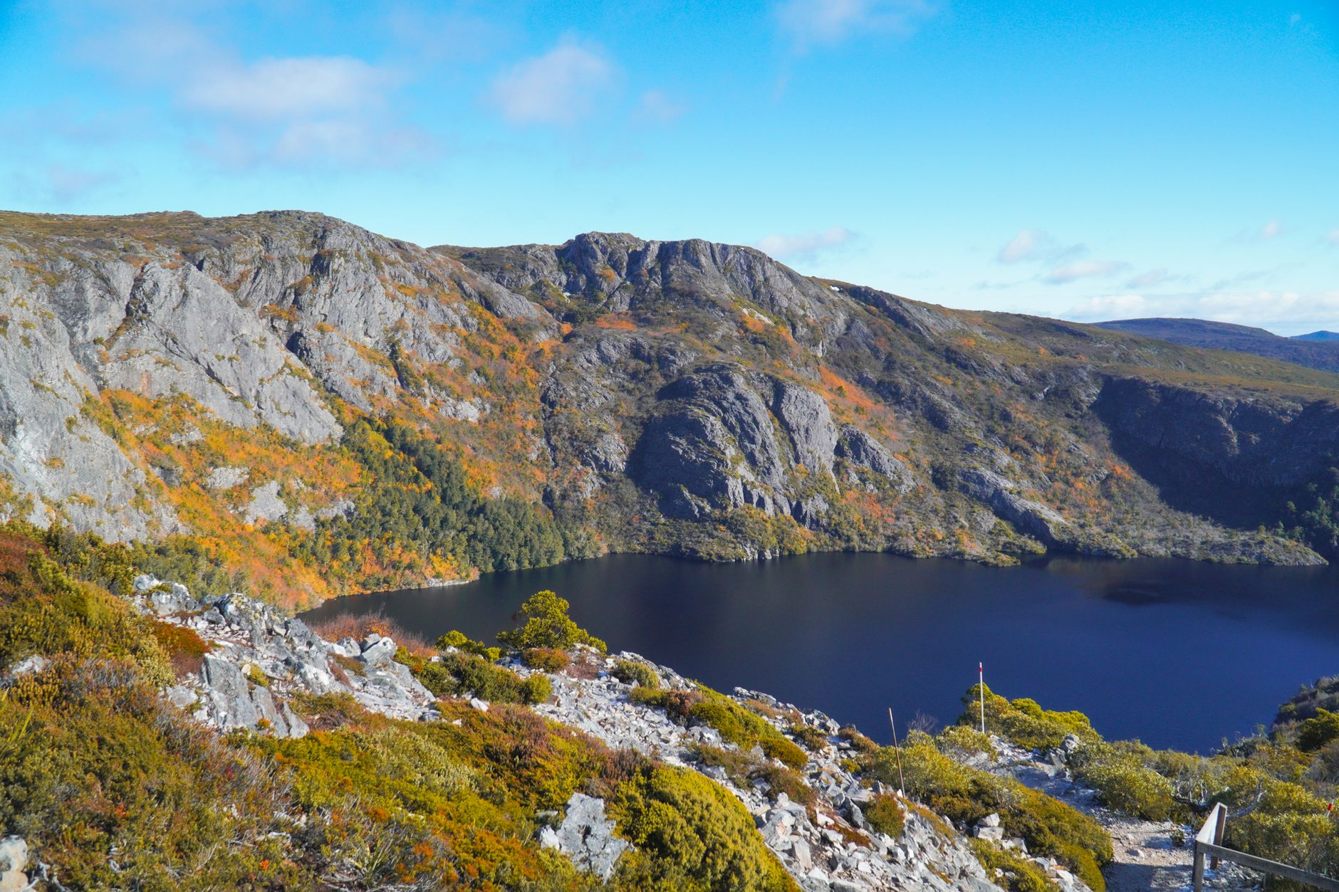 Lake surrounded by rocky mountains at Cradle Mountain, Tasmania